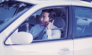 man on carphone while driving